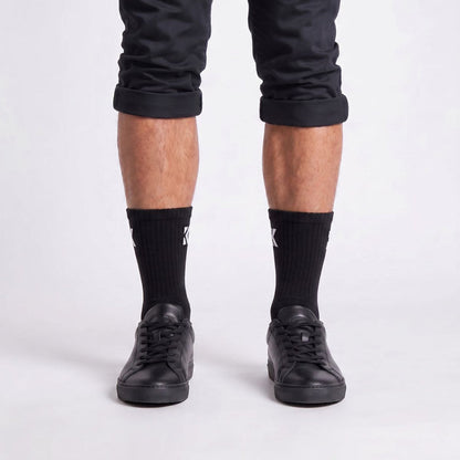 Model wearing black crew socks from the front, showcasing the classic fit and premium everyday style.
