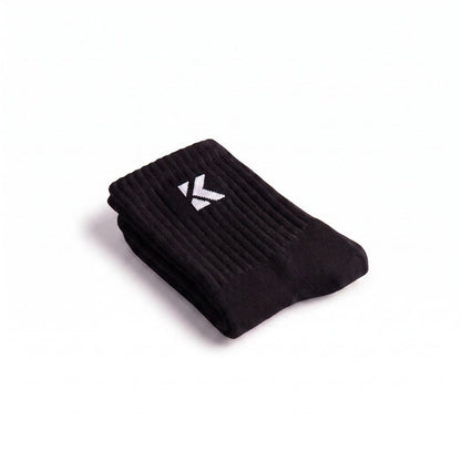 Folded black crew sock with a soft jacquard knit logo and premium construction.