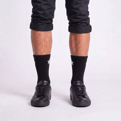 Model wearing Black Crew Socks with black sneakers, showcasing men's crew socks for athletic style.