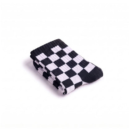 Folded black and white checkered crew sock showing texture and pattern
