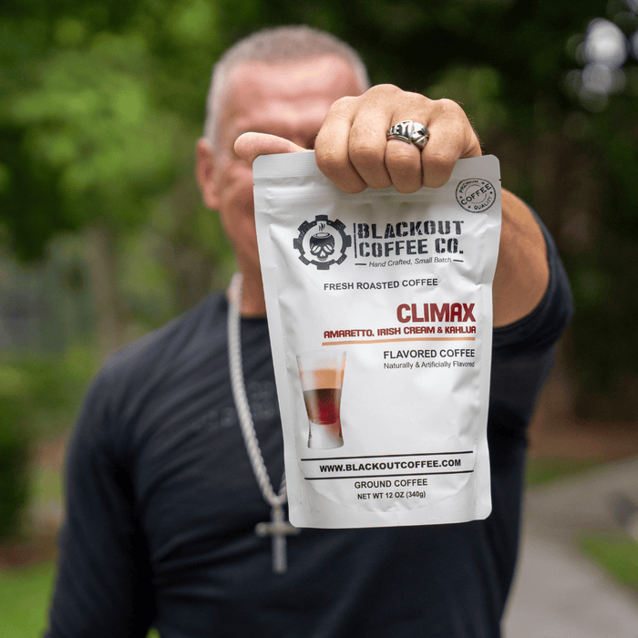 Climax man holding the coffee bag