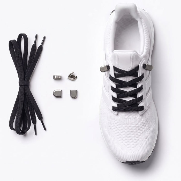 White athletic shoe with black no-tie shoelaces and small silver metal buckles, shown on a clean white background with the laces and eyelets laid out beside it.