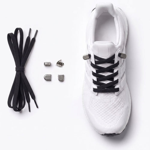 White athletic shoe with black no-tie shoelaces and small silver metal buckles, shown on a clean white background with the laces and eyelets laid out beside it.