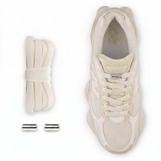 Elastic no-tie shoelaces with a silver capsule lock system installed on a Bone with Sea Salt New Balance 9060R sneaker.