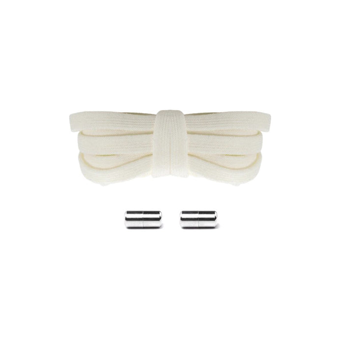 Light beige elastic no-tie shoelaces with silver capsule lock system for a premium all-black sneaker finish, easy slip-on fit.