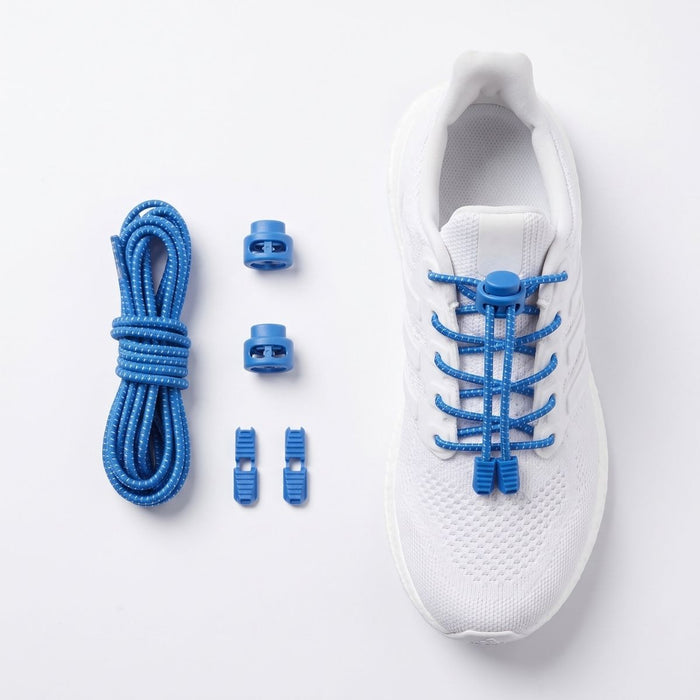 Blue elastic speed laces with plastic toggle clips and a coiled cord, shown next to a white athletic shoe on a clean white background.