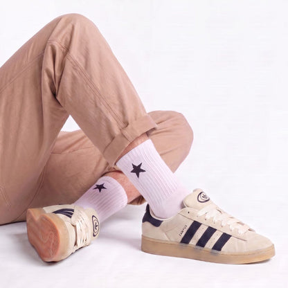 Model wearing Cream White Adidas Campus 00s with light beige 15mm wide replacement laces in a clean studio setting by Kicks Shoelaces