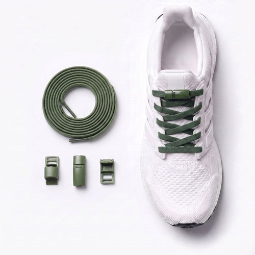 White sneaker fitted with magnetic no-tie shoelaces and a magnetic lock system.