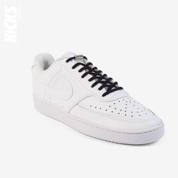 Black oval no-tie elastic shoelaces installed on white sneakers by Kicks Shoelaces
