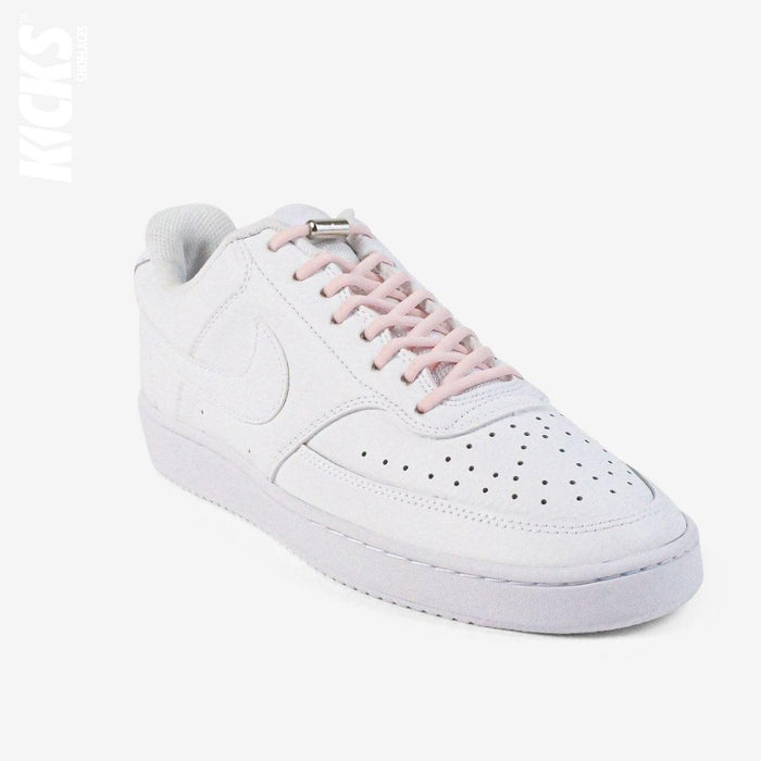 Pastel pink oval no-tie elastic shoelaces installed on white sneakers by Kicks Shoelaces