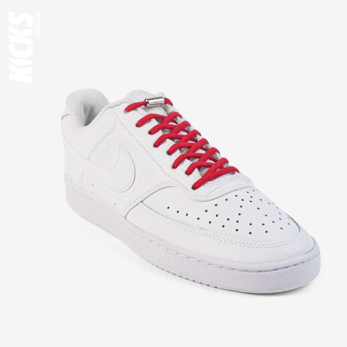 Red oval no-tie elastic shoelaces installed on white sneakers by Kicks Shoelaces