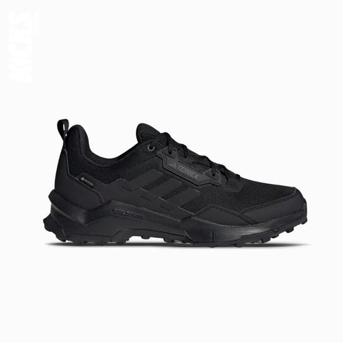 A pair of black Adidas GORE-TEX hiking shoes with replacement laces.