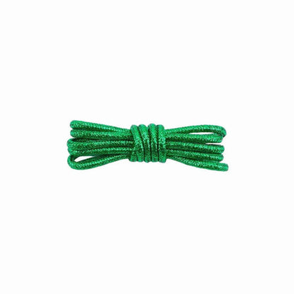 A pair of round, green glitter shoelaces tied in a knot on a white background.