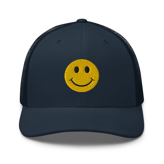 Navy smiley face embroidered trucker hat with adjustable mesh back, perfect for casual wear and streetwear style.
