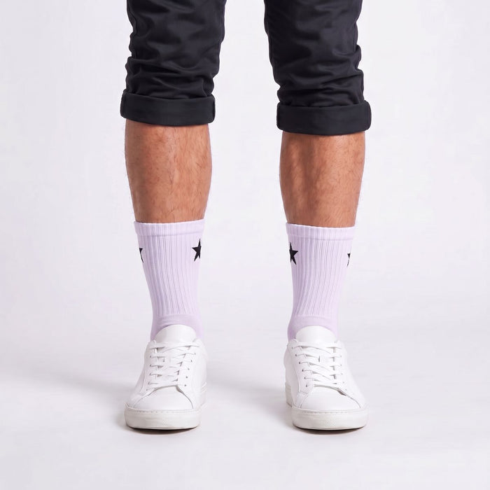 Model wearing White Crew Socks with white sneakers, showcasing men's sports socks.