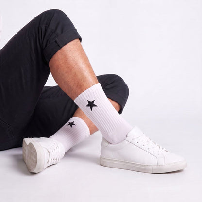 Model wearing White Crew Socks with white sneakers, highlighting moisture-wicking athletic socks with breathable comfort and cushioned support.